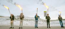 People carry torches en route to the beetle before setting it on fire during the 11th annual Burning Beetle event on Saturday, Jan. 20, 2024, at Pageant Park in Custer, S.D. The event was created in response to the Mountain Pine Beetle infestation a few years ago and continues to raise awareness of the impact of the beetles. (Matt Gade/Rapid City Journal via AP)