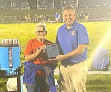 Coach John King’s mother, Rita, accepted his award in his absence at the Baltic High School’s Homecoming game on Friday, September 14. 2024.