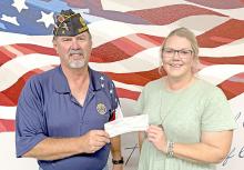 Gregory/Dallas Chamber president, Elizabeth VanOverschelde, presented American Legion’s commander, Greg Smith with a check for $200.00. The money was the proceeds from the first annual, Tri-County Poker Run, that the Chamber put on to help support the Legion’s, Be the One program, and Flags for Cemeteries.