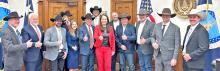 Kenny Graner (far right), Brett Kenzy (behind and to the right of USDA Secretary Rollins) and several other ranchers meet with USDA Secretary Rollins (in red) to speak to her on behalf of the Conservative Political Action Conference about cattle industry issues. (CPAC | Courtesy photo)