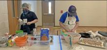 Jaxon Sargent and Kyrie Matucha preparing their dishes.