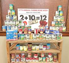 Fresh Flower Studio celebrated Caring Rose Week this year by organizing a community food drive. For $10 and 2 cans of canned goods, customers received 12 roses. The business collected 100 cans of food, pictured here, which have been donated to the Gregory Food Pantry to help stock shelves for the upcoming season.