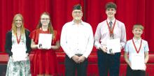 The Gregory American Legion awards were presented to eighth grade students. The winners of the Legion awards were presented by John Knight, First Vice Commander, center. Receiving the awards were l to r: Abigail Engel (honorable mention), Charissa Ring (winner), George Timanus (winner), and AJ Lutt (honorable mention).