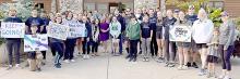 Everyone who attended the memorial 5K was invited to stamp their thumbprint “leaf” on the tree in either purple or teal, colors that signify suicide awareness. (Photo provided by SDSU Wellness Center)