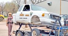 Sgt. Ryan Lantz of the South Dakota Highway Patrol brought the rollover simulator to show students how a seat belt will keep them from falling out of a vehicle in the event of a rollover accident.