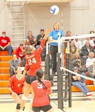 Aubree Miller, #24, uses her height at the net. (Photo by Sara Anderson)