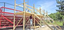 Dylan Fiebelkorn, part of Joe Klein’s construction crew, works on a new crows nest at the city ballpark. The project is a Brian Anderson memorial. Ground breaking for the new crows nest was held last July, and the dedication will be held at a later date. The plan is to have the structure completed by the Jr. Teener State Tournament, July 24-26, which Gregory will host.