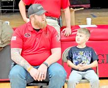 Police Deputy Jeremy Atkin discusses what would happen with a smaller passenger in the front seat (Jaxon Bearshield) if an airbag deploys.