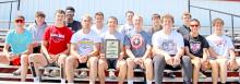 Shown with their first place plaque from the region track meet are members of the boys team, shown back row, l to r: Pierce Stukel, Daniel Mitchell, Trey Murray, Cruz Klundt, Noah Bearshield, and Ryler Stevicks; front row: Fin Adams, Max Cook, Jhett Eklund, Luke Stukel, Paul Sinclair, Rane Kenzy, Lucas Barreto, and Jess VanderPol. (Photo by Katie Bolander)