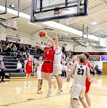 Landon Keiser goes up against a Black Panther defender in last Tuesday’s game against Platte-Geddes. (Photo by Maya Hull)