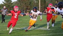 Rylan Peck carried the ball 15 times for a total of 131 yards in Gregory’s 60-34 win over Wolsey-Wessington in Friday’s season opener. (Photo by Alexis Kortan)