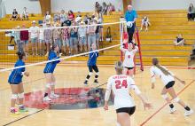 Dani Timanus sets the ball in Gregory’s game against Todd County last Tuesday. The Spikers were able to win the five-set game.
