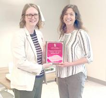 Dr Carolyn Gilbertson, Department Chair for USD Sanford School of Medicine, presents a plaque to Dr. Even on Thursday, May 23, 2024. The award was established to recognize an outstanding clinic faculty member from the Department of Family Medicine.