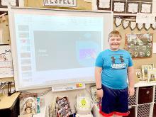 Third grader Ian Opp demonstrated his knowledge of Asia to the school board Monday evening with a computer presentation he put together. The third graders have been studying the continents.