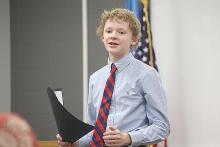 Thor Aanenson, a freshman at Freeman Public, presents “The Good News on Poverty” in the Class B category of Non-Original Oratory Saturday afternoon, Dec. 3. Aanenson received a superior for his presentation of the TED Talk first given by U2 singer Bono in 2013. (Photo by Jeremy Waltner/for SDPB)