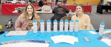 Lauren Svatos, l, and Brooklyn VanDerWerff, r, spoke to attendees about work-from-home opportunities with Principal Financial.