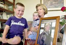 Todd Beamer’s children and wife, Lisa, sit beside his photo in their home in Cranbury, N.J.