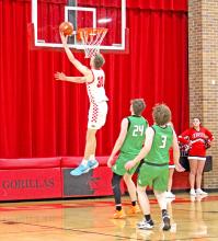 Colt Keiser goes to the upper deck as Miller players can only watch. (Photo by Maya Hull)