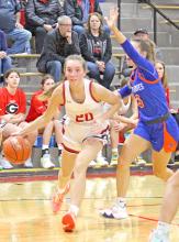 Asia VanDerWerff makes her way around a Parkston defender in last Monday’s game at home.