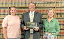 Left to right; Amy Johnson, George F. Johnson with his Distinguished Service award, and Steffanie Pochop.