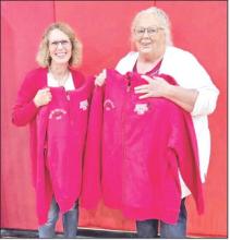 Kimberly Veskrna (l) and Penny Sperl (r) were named fans of the year by the Gregory Athletics Club during the coronation ceremony.