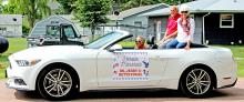 Dr. Jerry and Bette Fogel were decked out in patriotic colors to lead Gregory’s parade through town.