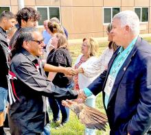 Mark Vargo, right, shakes hands with members of the Wambli Ska Society on Sept. 13, 2022, in Pierre. (Photo courtesy of SD Attorney General’s Office)