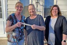Presenting Marlene Rezac a check for over $5,400.00 is Alisa Schmitz and Lisa Kerner from the IOOF Lodge. The fund-raiser was held to help raise money for medical expenses for Marlene.