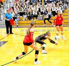 Haylie Vaughn digs the ball for the Spikers.