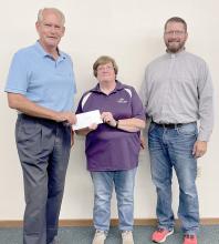 Each year St. Joseph Catholic Church makes donations to charities or entities that provide a needed service for our community. This year, Parish Council President Joe Duling, left, and Deacon GW Ekroth, right, presented a check to Dawn Boyer of Hilltop Drive-Inn Theater.