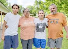 Frances (second from left) and Robin (far right) Bair and their children were one of the families that participated in the Spiritual Run for the Sacred Pipe.