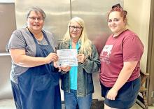 May is National Beef Month, a time to recognize and honor the hardworking ranchers, farmers, and producers who dedicate their lives to raising high quality American Beef. Deanna Nelson, middle, representing the Rosebud Rancherettes, donated beef certificates to Bernadine Holmberg and Jamie Schrader, representing ROCs Dining Services to purchase 100% American Beef.