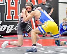 Eli Ekroth pinned all three of his opponents to get his first high school tournament win on Saturday in Ainsworth. (Photo by Ainsworth Star Journal)