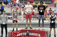 Daniel Mitchell, second from right, placed second in high jump during the Dan Lennon meet in Vermillion.