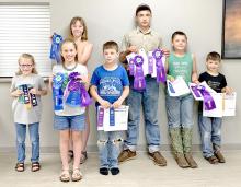 Participants in the pre-fair day are shown here with their ribbons. Shown l to r, they are Zoe Koenig, Mya Koenig, Addie Dostal, Owen Schulte, Jack Schulte, Jhett Schulte, and William Schulte.