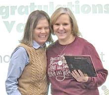 Valerie Johnson of Gregory, who is a school psychologist with CORE Educational Cooperative, was named School Psychologist of the Year by the South Dakota Association of School Psychologists at their annual fall conference. Valerie was not able to accept the award in person, so is shown here receiving her plaque from Kristi Kafka, another one of CORE’s school psychologists, at a CORE meeting. Valerie covers the Gregory and Colome School Districts for CORE.