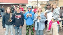 Winners from this year’s turtle races are shown l to r: Vanessa and Marissa Fischer, Cole Davis, Lily Jacobsen, and Keviana Sundquist, in the arms of her dad Jerin Sundquist.
