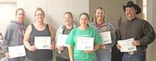 Registered 4-H volunteers are pictured from l to r: Sarah Bailey, Erin Schulte, Kendra Wiechman, Sheila Imhof, Mollie Andrews, and Jake Imhof.