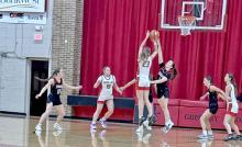 Lady Gorillas close in on the hoop against Lyman. (Photo by Brenlee Braun)