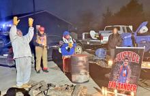 Robin Bair (left) of the Yankton Sioux Tribe sings a calling song at a candlelight vigil held Dec. 11, 2024, for Zander Zephier in the tribal community just north of Wagner, S.D. (Photo: Stu Whitney / South Dakota News Watch)