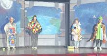 On Friday, July 24, 2026, local youth performed Space Pirates! at the Gregory Memorial Auditorium. From left to right; robot, Brenlee Braun, Edie from Theatre 605, and alien interns — Paisley Graber and Jessa Bartling.