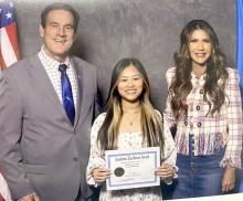 Vy Nguyen, center, of Gregory High School, was presented an Academic Excellence Award from Governor Kristi Noem, right, and Lt. Gov. Larry Rhoden, left. A luncheon was held to honor all students who ranked in the top one percent of their senior classes.