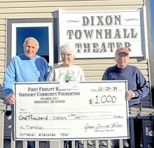 First Fidelity Bank and Gregory Community Foundation presented a grant check to the Dixon Townhall Theater for upcoming projects. Pictured from left to right are Dr. Jerry and Bette Fogel, and Emmett Kotrba.