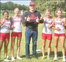 The girls varsity cross country team, shown l to r: Ellie Talsma, Abigail Engel, Coach Lonnie Klundt, Emily Grim, and Kennley Sedlacek, finished in first place at the Wagner Invitational. The boys varsity team also finished first. (Photo by Nancy Grim)