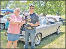 On Saturday, July 4, 2026, the Street Bandits Car Club, along with their sponsors, Harry K NAPA, Rosebud Electric Cooperative and Gus Stop, hosted Cars in the Park. Mayor Laura Petersen pictured with the Mayors Choice Winner, Tory Engel and his 1966 Ford Mustang.