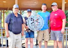 “Opp”eration Smoke operated well at Ribfest and took home the Pit Master trophy on Saturday. Michelle Birkeland and Jim Birkel presented Bruce and Jared Opp with the grand prize.