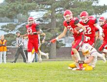 Colt Keiser, #12, works to free himself from a Cavalier defender in Friday night’s win. (Photo by Kristy Ring)