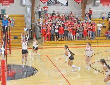 Attackers approach the net in unison, with support from Gregory students. (Photo by Kristy Ring)