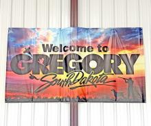 The new Welcome to Gregory South Dakota sign is in the big hangar at the Gregory Municipal Airport/Flynn Field. This sign is meant to welcome pilots to our area and serve as a thank you for choosing Gregory Municipal Airport. There is also a new sign listing the hangar fees and a convenient drop box for payment. The new signs were paid for with money the airport receives from the fuel taxes.