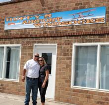 Mike and Jacky Hoffman, shown here outside their downtown Spencer building, are the owners of Huffy’s Airport Windsocks.